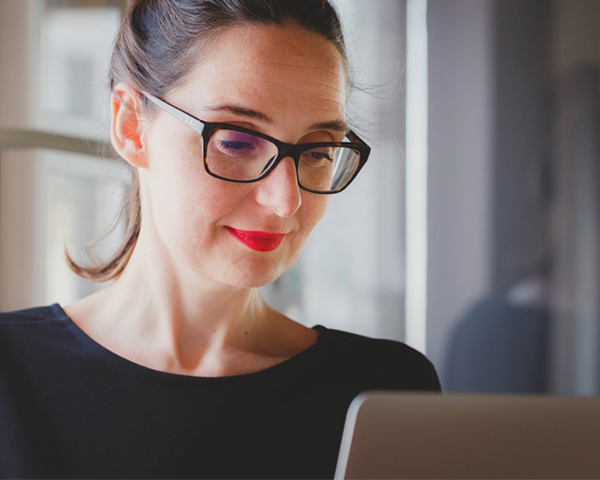 Corporate Event Planner - Smiling Woman With Laptop