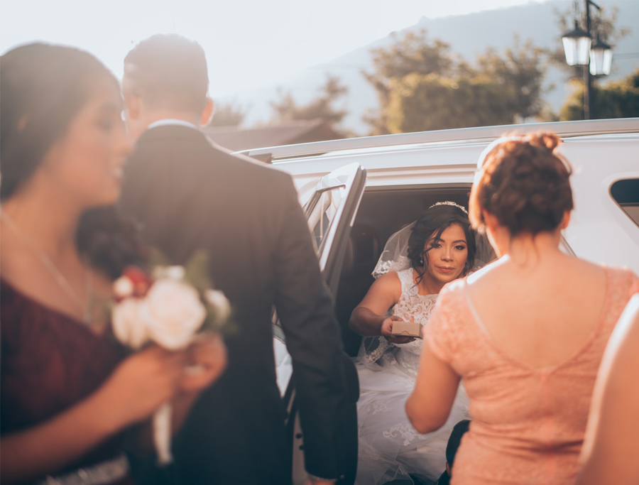 Wedding Vendors - Bride Getting Out Of A Limousine