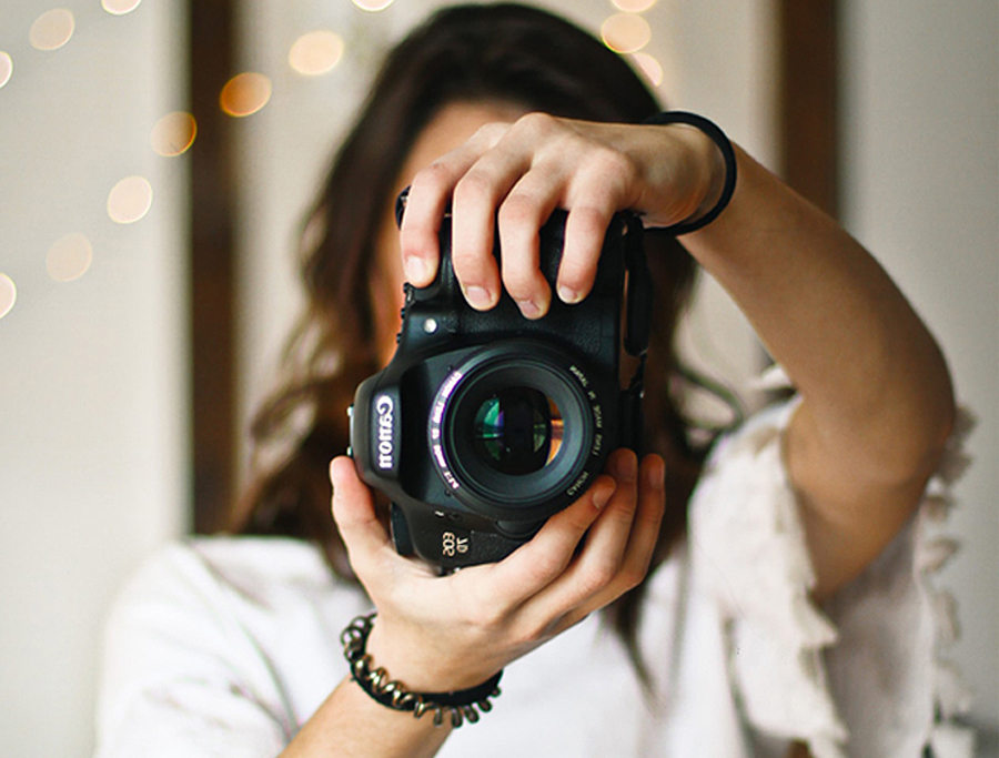 Wedding Vendors - Photographer Holding Up Camera