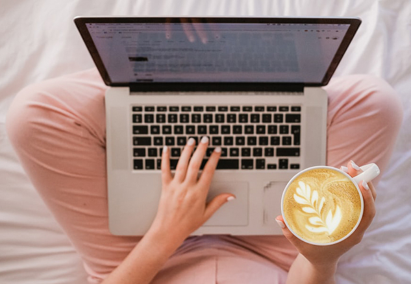 Wedding Registry - Woman On Laptop With Coffee